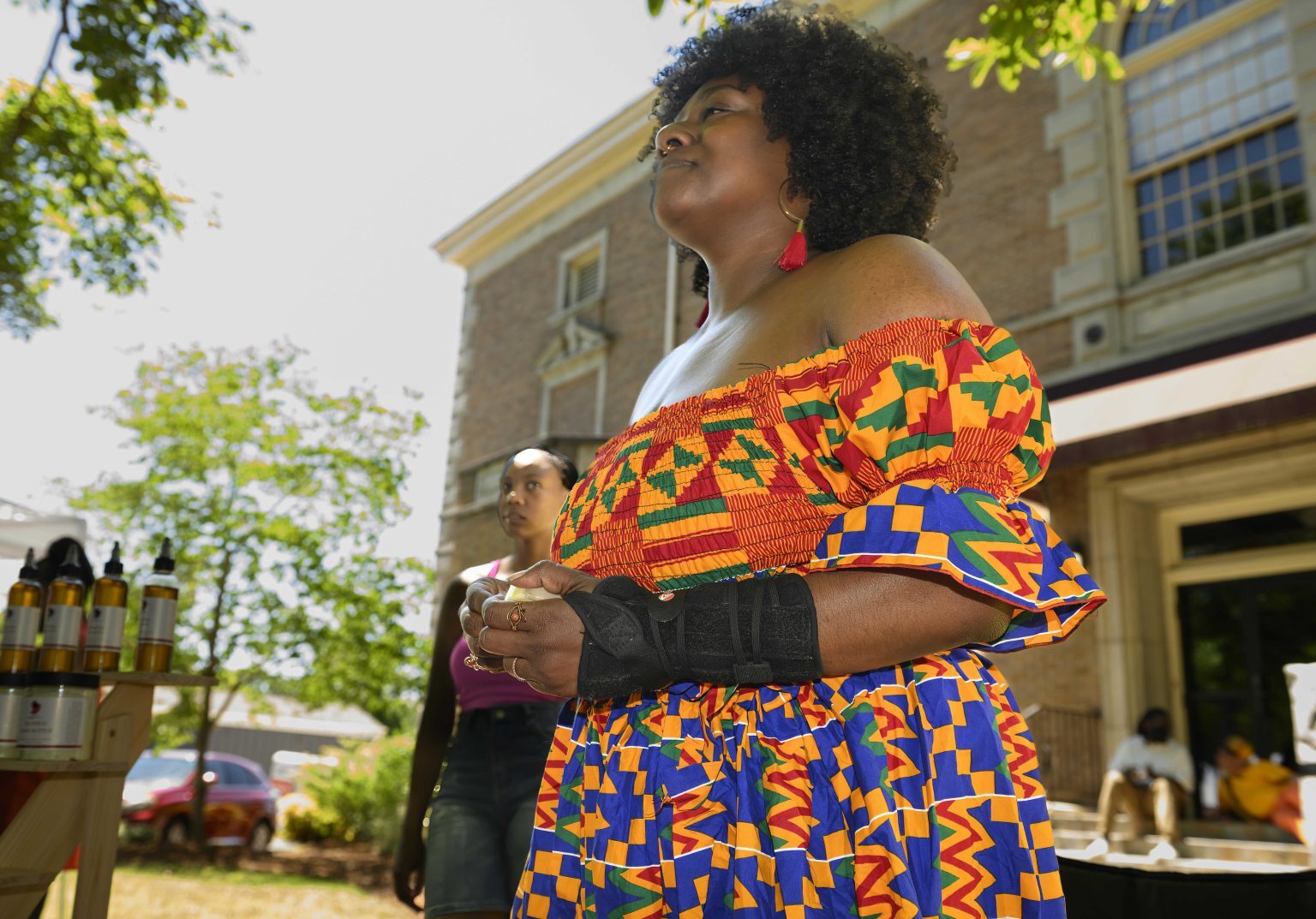 Community member in traditional dress at a branch event