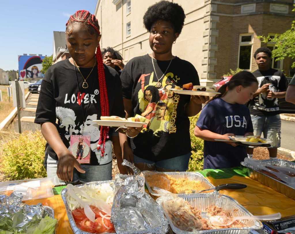 Volunteers serving food at a branch community event