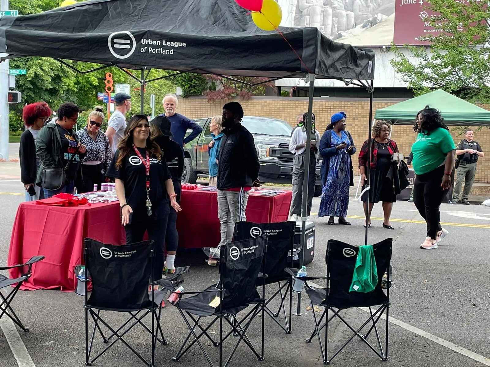 Membership committee volunteers at a street outreach table